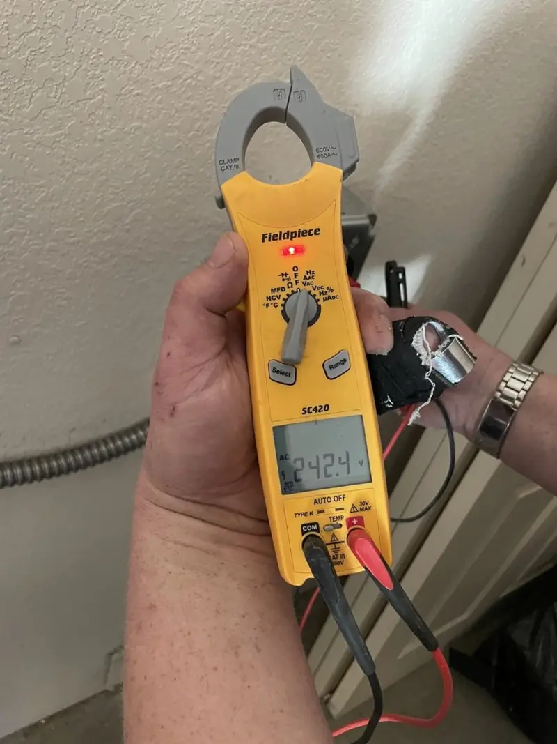 Voltage testing with clamp meter during Aluminum Wiring Replacement in Spring Valley Village